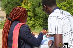 Blondine and David, the French Interpreter, discuss during the exercise.